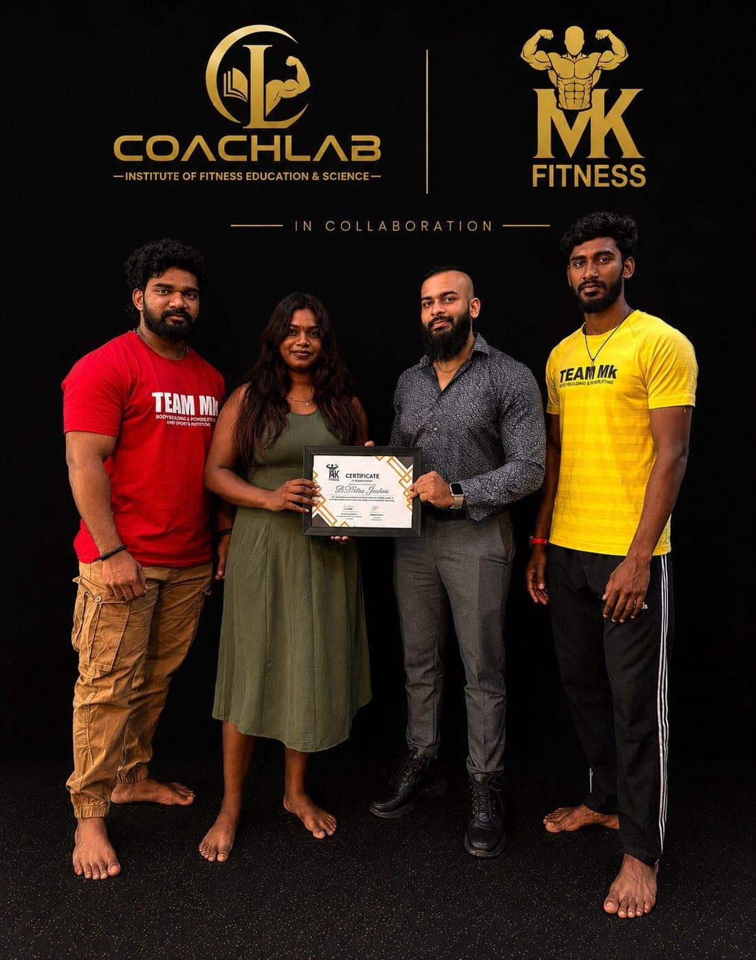 A CoachLab student holding her certificate alongside the instruction team.